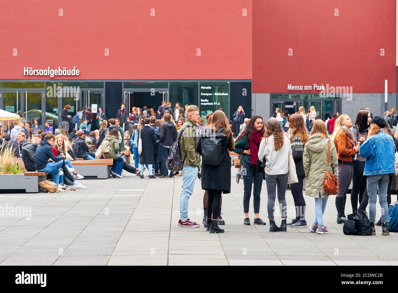 young students on the university campus in Leipzig during a break Stock Photo