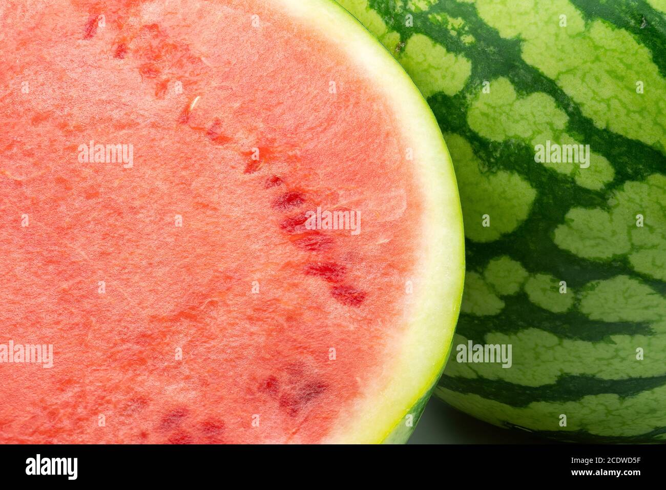 Watermelon close-up whole and half background. Stock Photo