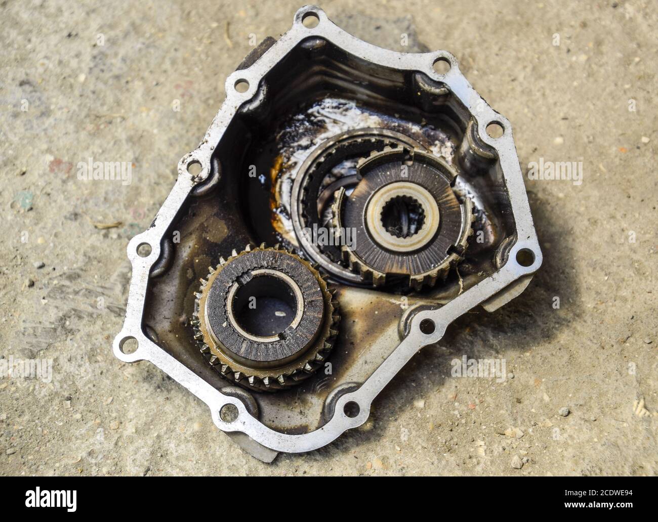 Dismantled box car transmissions. The gears on the shaft of a mechanical transmission. Stock Photo