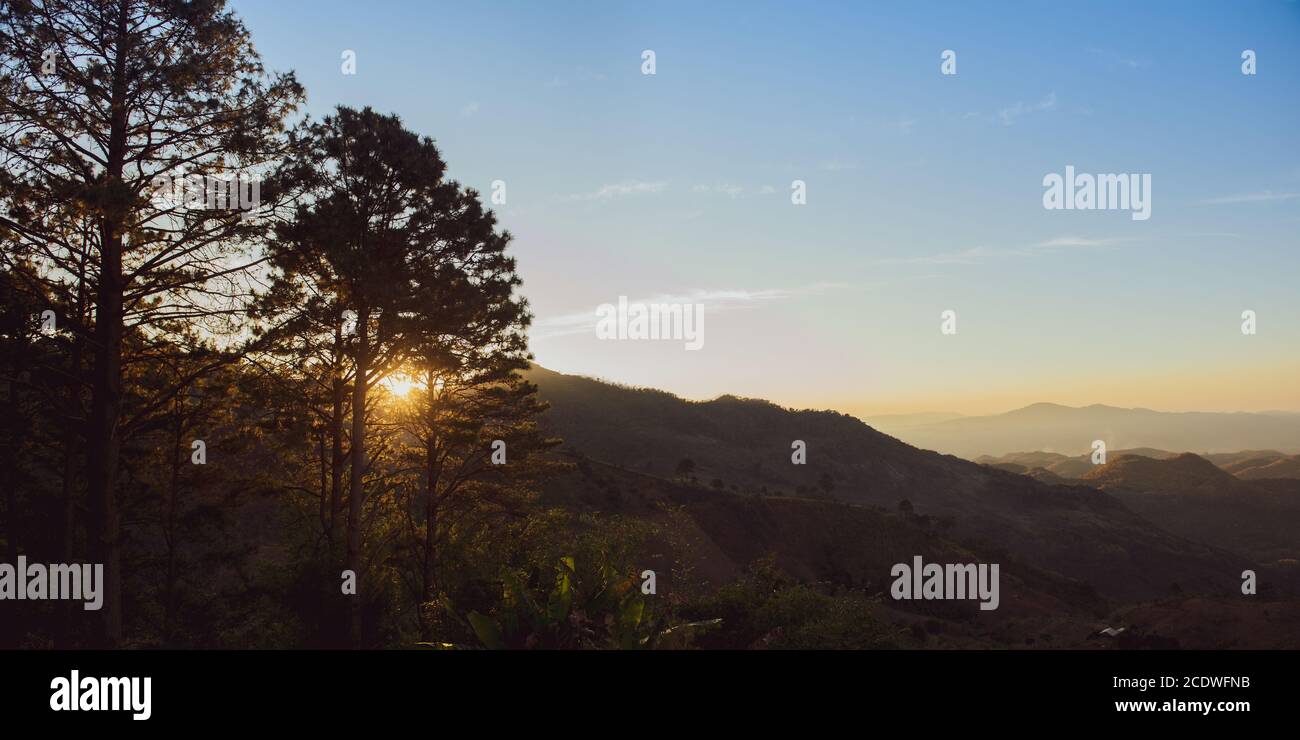 Amazing mountain landscape with sunrises on the sky, natural outdoor travel background. Beauty world. Stock Photo