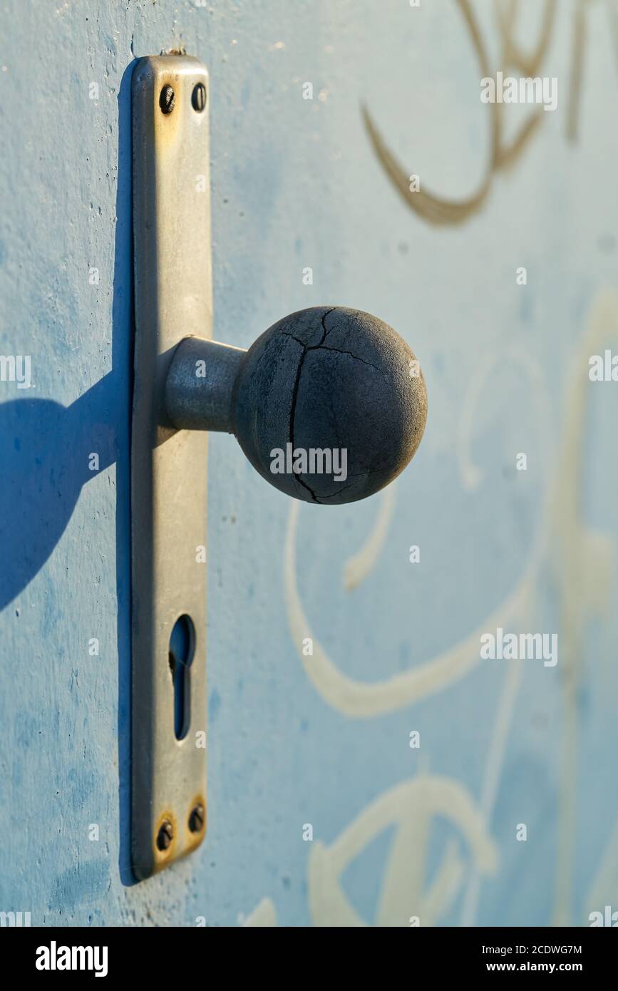 Doorknob on a steel door in the harbor of Magdeburg Stock Photo