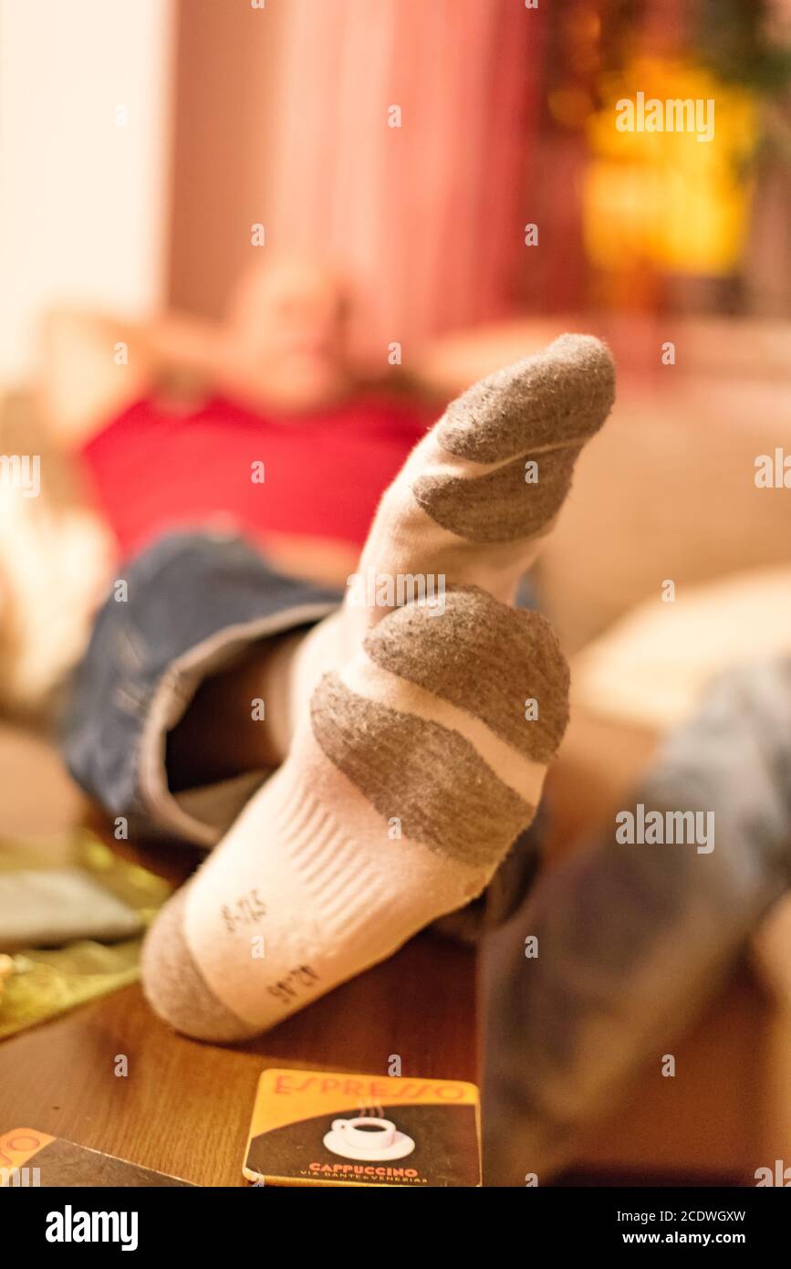 Feet on the table and wearing white sports socks Stock Photo