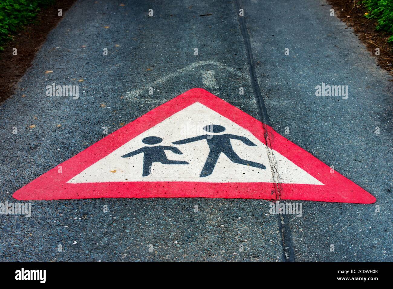 Traffic sign Attention children playing on the floor of a street Stock Photo