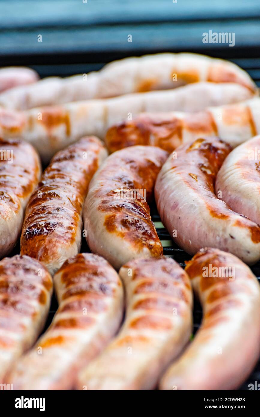 Brat sausage are on the charcoal grill Stock Photo
