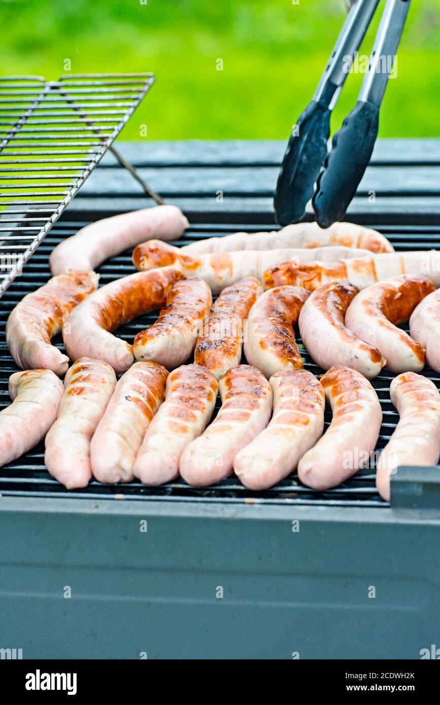 Brat sausage are on the charcoal grill Stock Photo