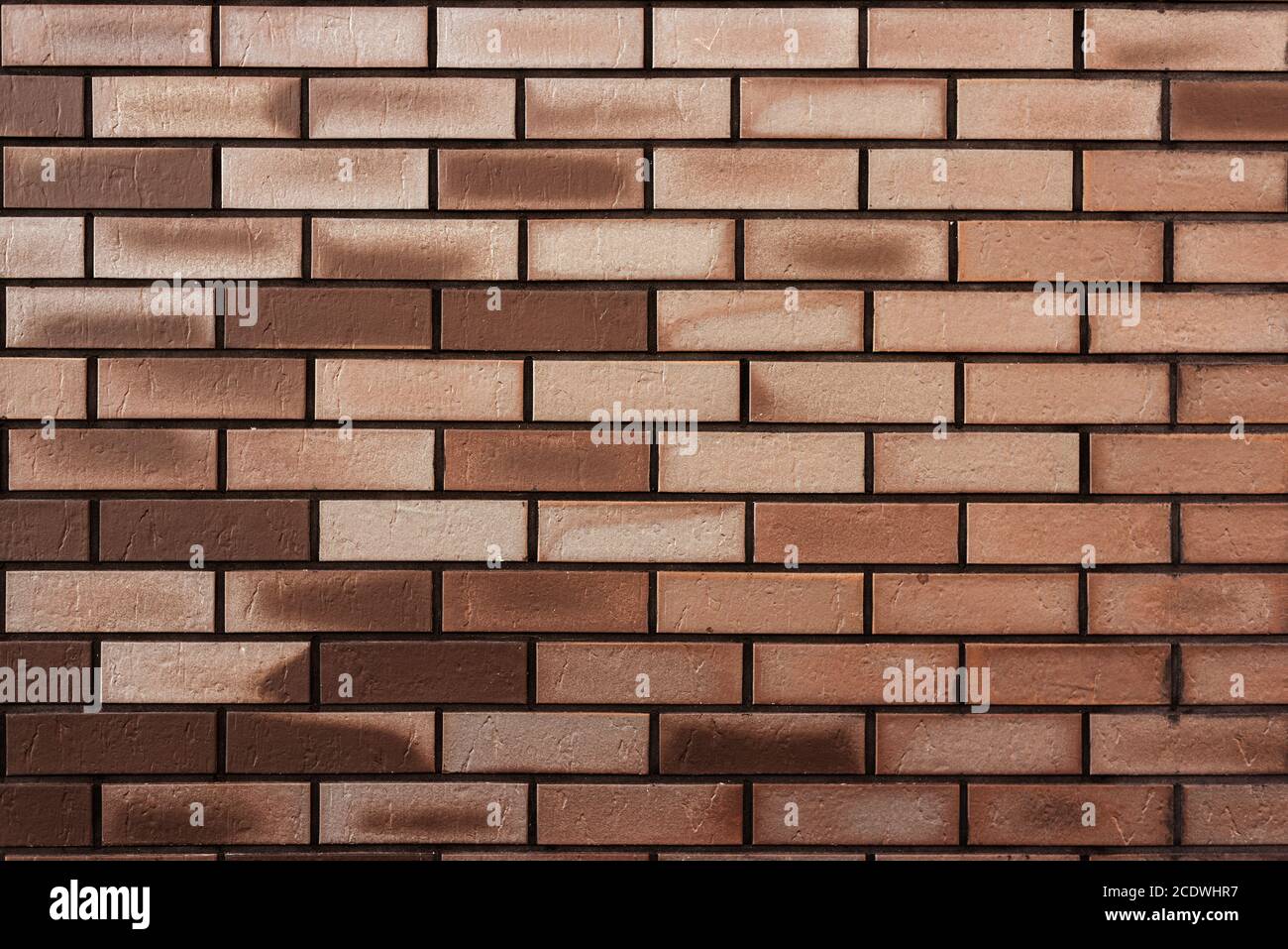 Brown brick wall. Abstract textured background. Space for text Stock Photo