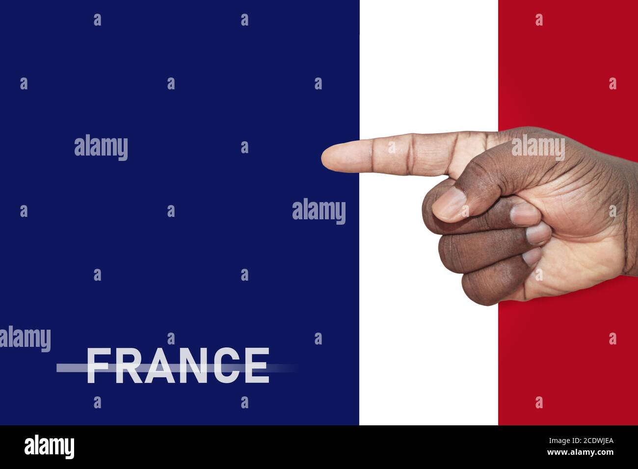 Man's hand pointing to blank sign with the colours of the French flag. Nationalism and politics concept. Stock Photo