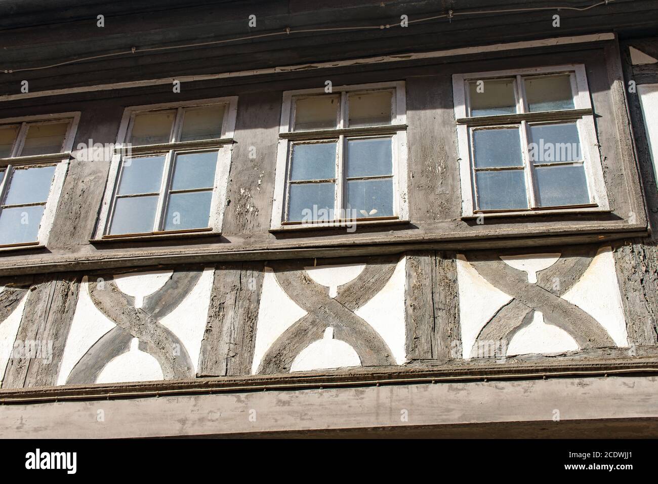 Old weathered half-timbered house at a house Stock Photo - Alamy
