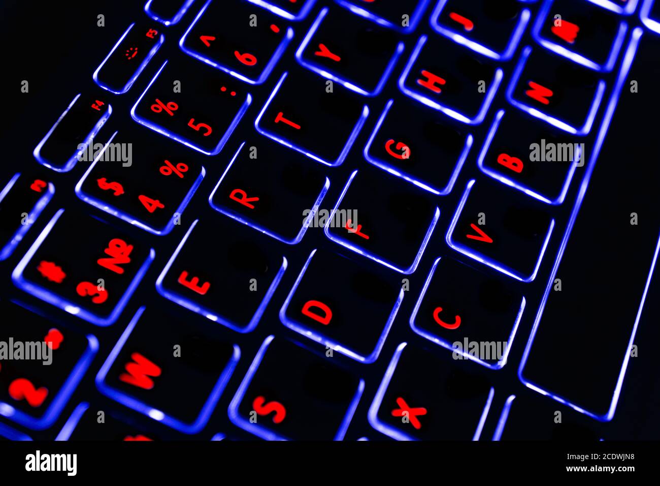 Function Blue Button Close up view of a modern laptop computer keyboard key with blue ...