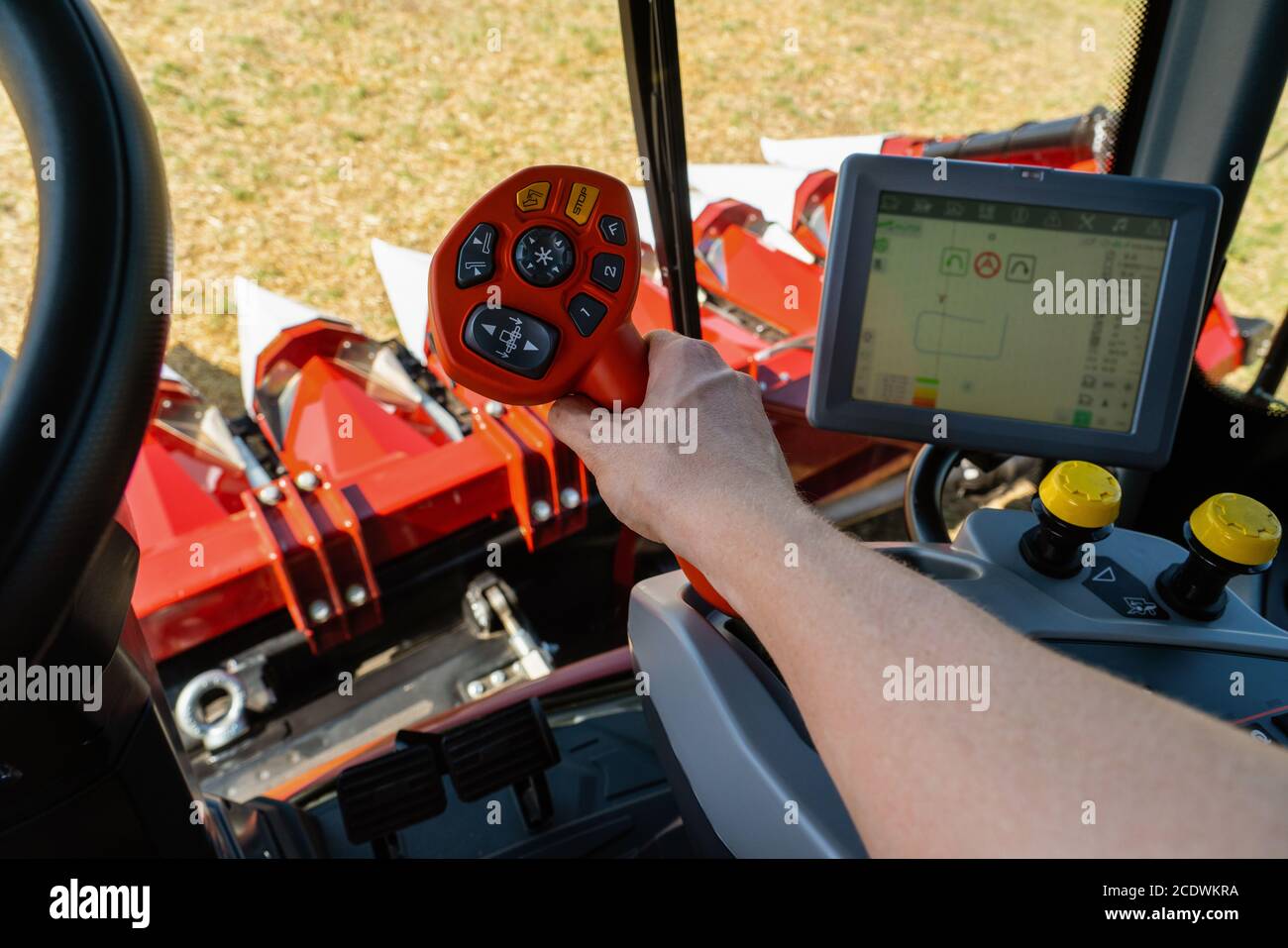 Farmer controls the combine harvester Stock Photo Alamy