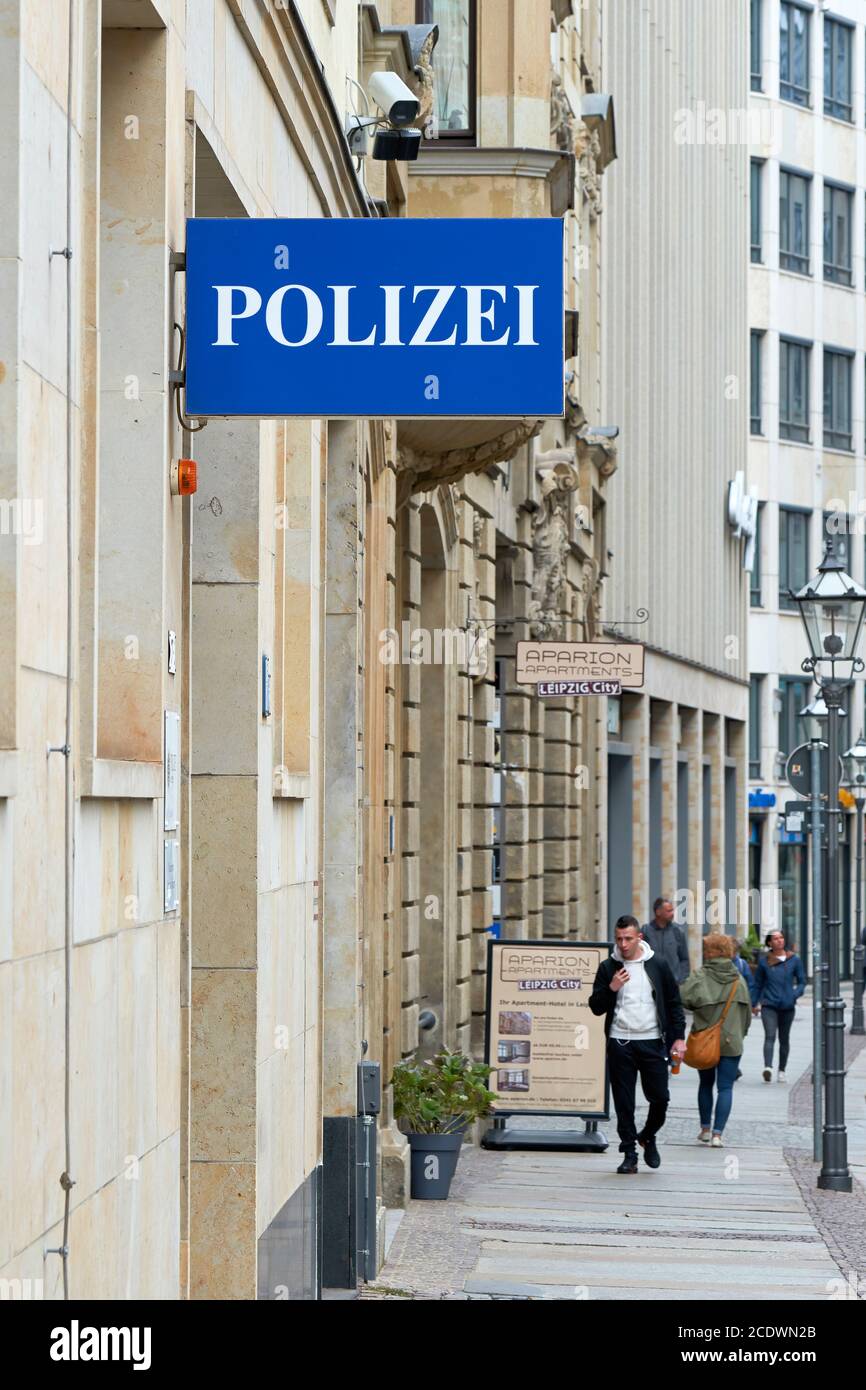 Sign with the inscription Police as an indication of a police station in Leipzig Stock Photo