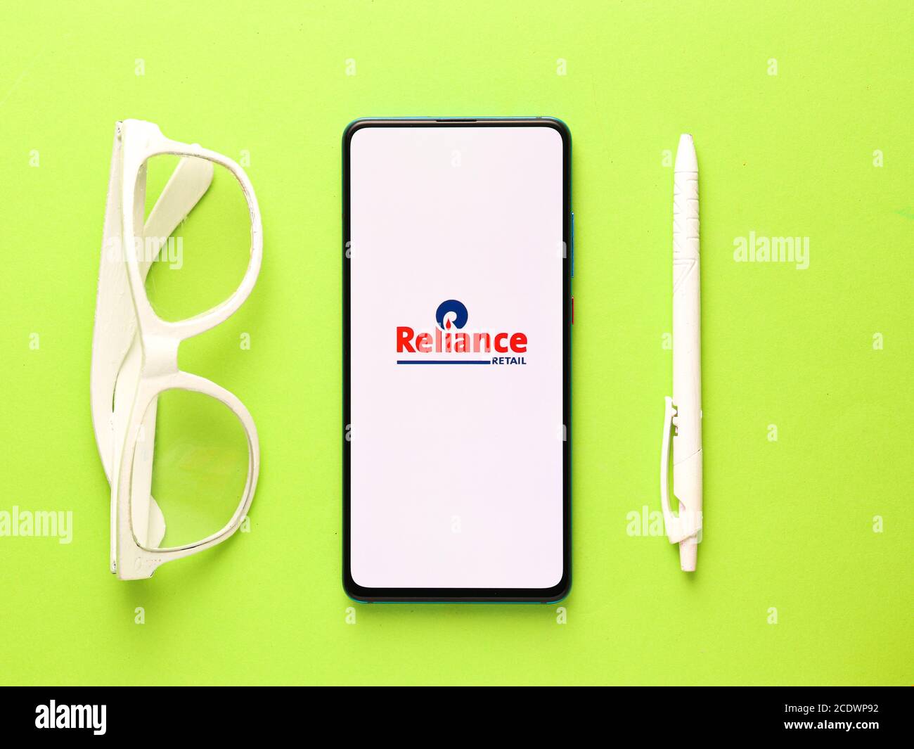 Assam, india - August 27, 2020 : Reliance industries logo on phone screen stock image. Stock Photo