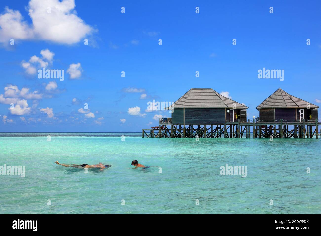 Beautiful Maldives beach with snorkel and water bungalow. Stock Photo