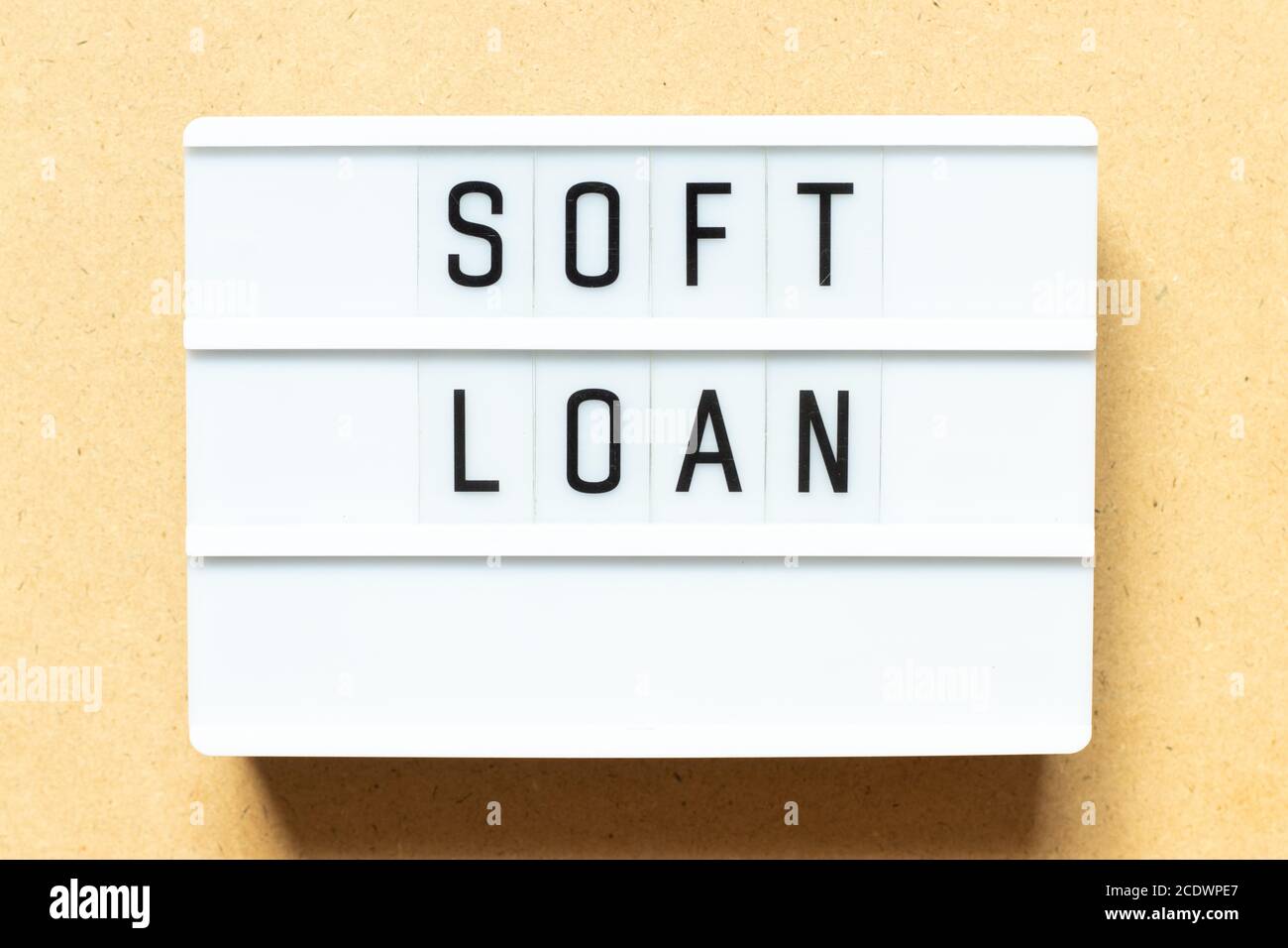Lightbox with word soft loan on wood background Stock Photo
