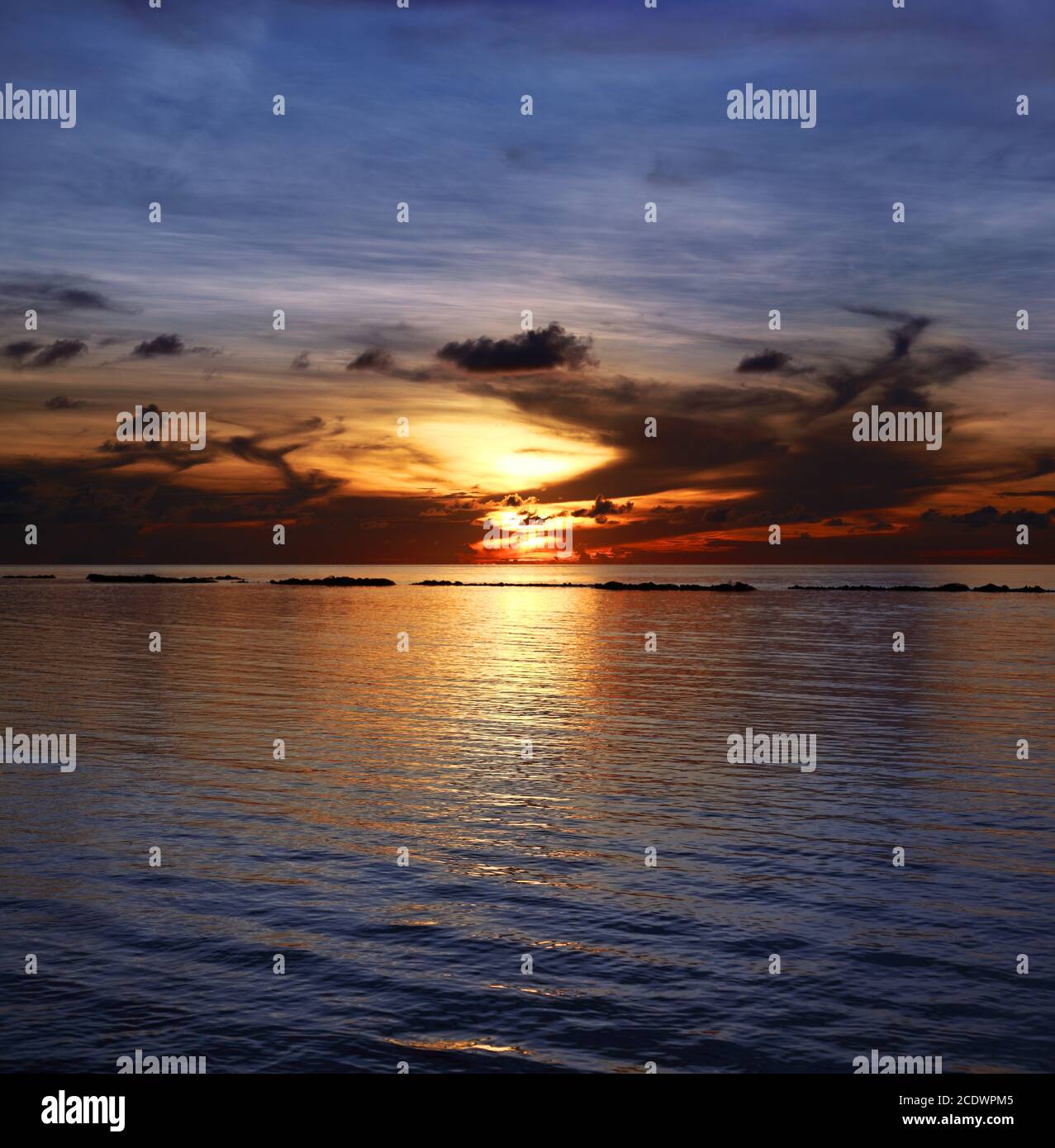 Beautiful sunset at Maldives beach Stock Photo - Alamy