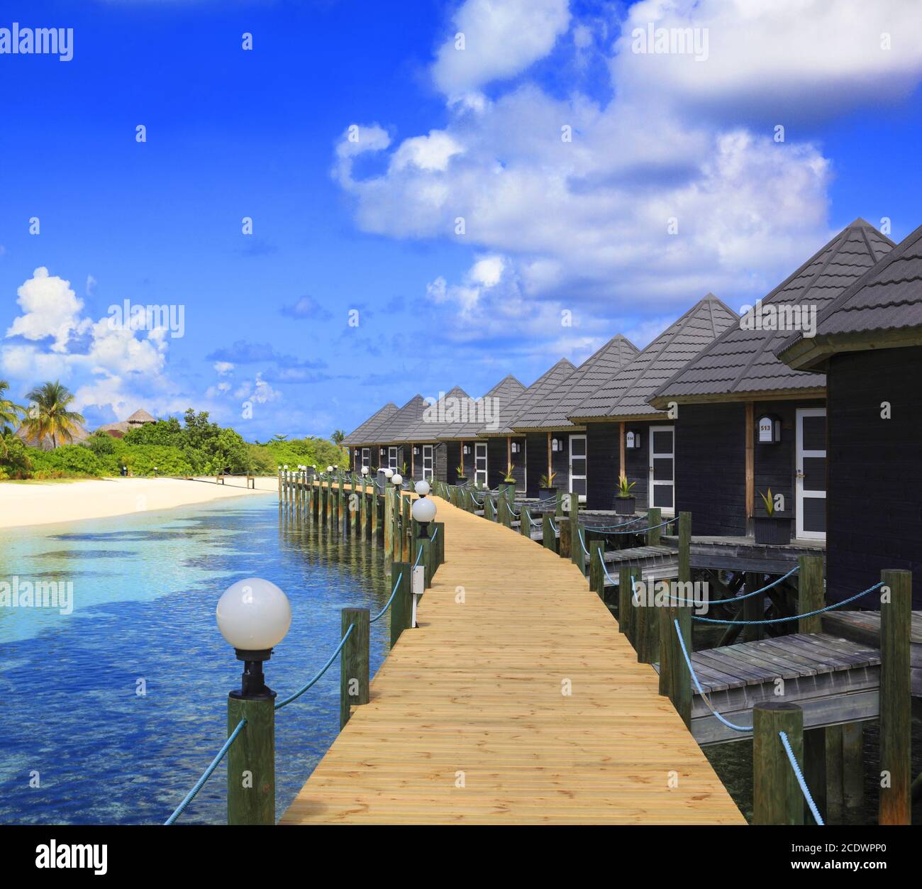 Beautiful Maldives beach with water bungalow. Stock Photo