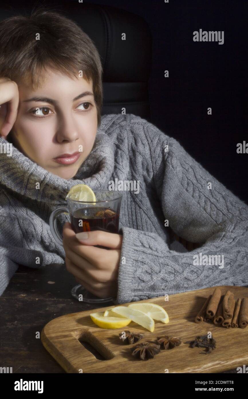 Young woman with hot drink Stock Photo