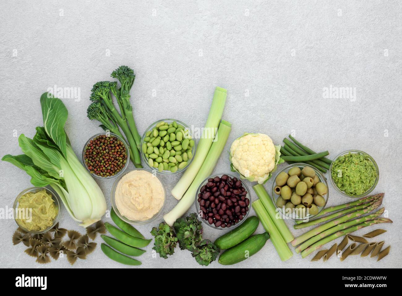 Low glycemic health food for diabetics with vegetables, dips & pasta with all foods below 55 on the GI index. High in antioxidants, vitamins, minerals Stock Photo