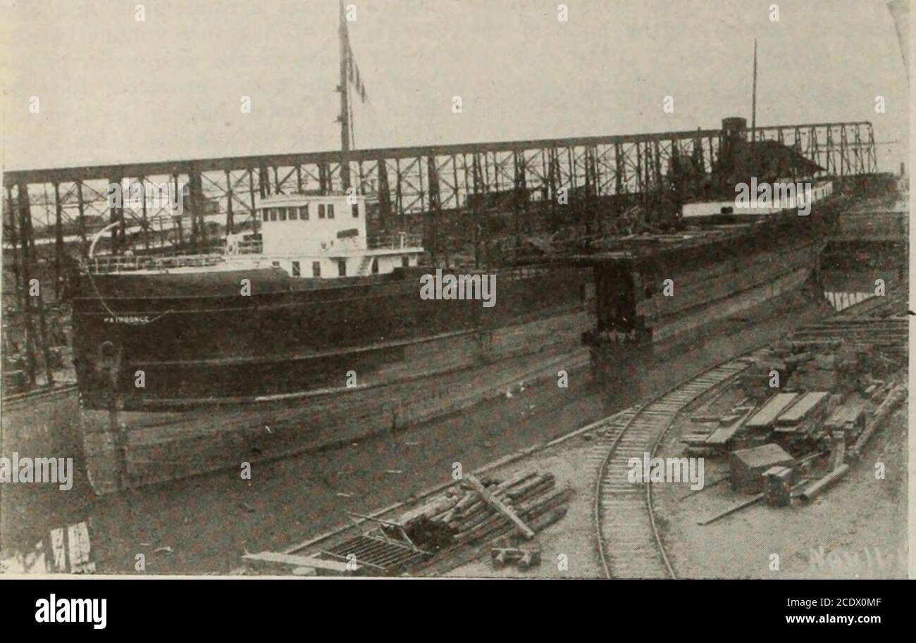 . Canadian Shipping and Marine Engineering January-December 1919 . AMES IN C3Z.LIInG.V00D DRV DOCK 14 MA KINK KiNGINKKKINd OF CANADA Volume IX.. SS. •PAIPOONGE AFTER CUTTING the usual punching and shearing ma-chines are installed, and a 12 foot platerolling machine of the vertical type is inevidence. The drilling is all carried outby air drills, the multiple horizontal drillusually in evidence not being employed.There being no flanging done, there isno hydraulic outfit. The Compressor Plant The compressor plant is rather un-usual. One looks in vain for the familiar horizontal compressor and mo Stock Photo