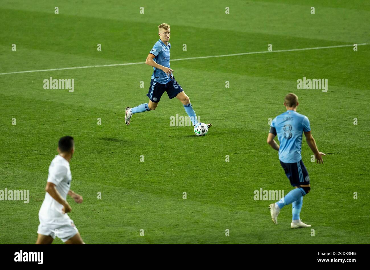 Keaton Parks (55) of NYCFC controls ball during MLS regular season game against Chicago Fire FC at Red Bull Arena. Game was played without fans because of COVID-19 pandemic precaution. NYCFC won 3 - 1. All supporting staff and players on the bench were wearing facial masks and kept social distances. (Photo by Lev Radin/Pacific Press) Stock Photo