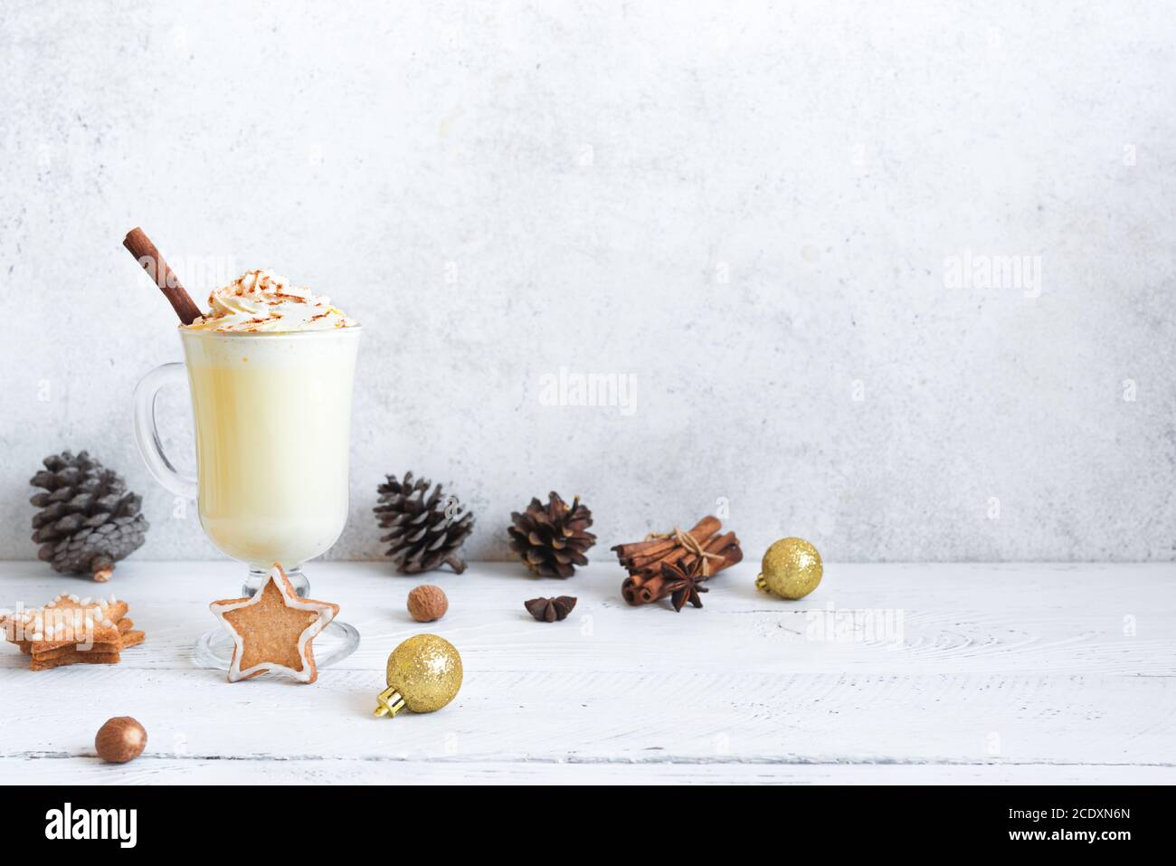 Christmas Eggnog drink with festive decor, gingerbread cookies and ...