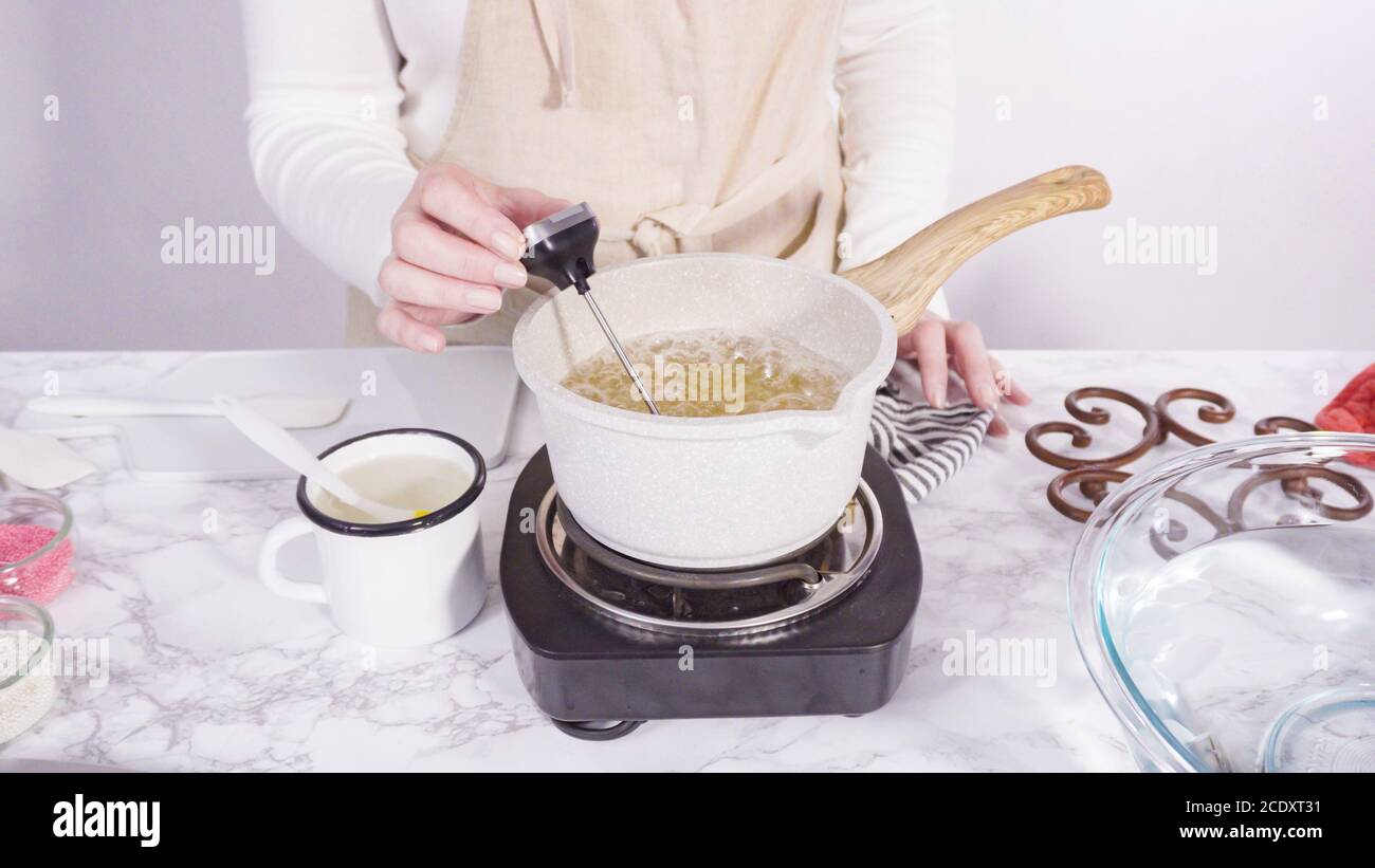 Step by step. Caramelizing sugar in a small cooking pot over the small