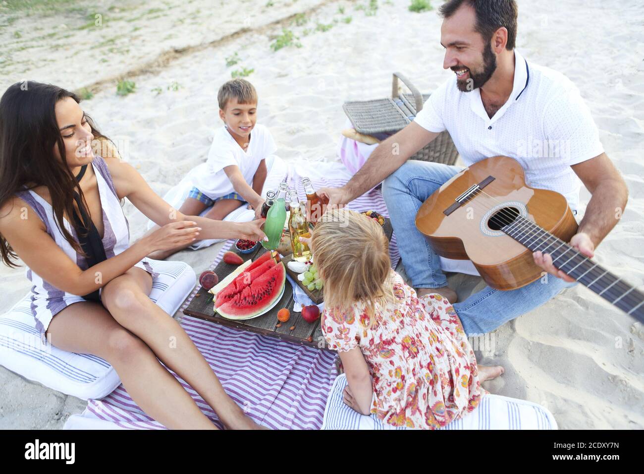 Family having picnic on beach Stock Photo Alamy