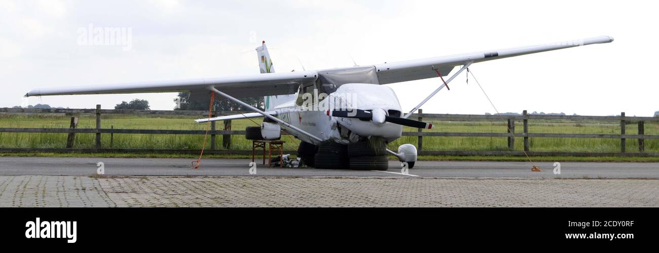 St. Peter Ording, Germany. 30th Aug, 2020. A damaged single-engined Cesna is jacked up on tires at the airfield. The small aircraft had crashed during landing, one passenger was slightly injured. Credit: Wolfgang Runge/dpa/Alamy Live News Stock Photo