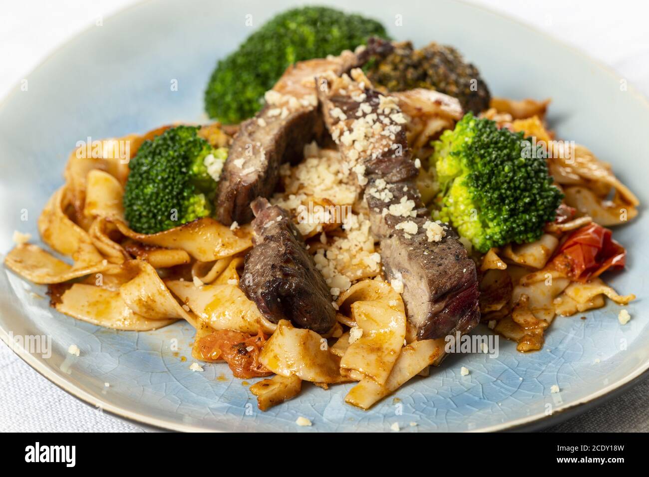 Tagliatelli with steak slices on the plate Stock Photo