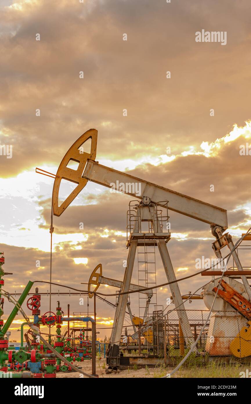 Petroleum concept. Oil pump rig. Oil and gas production. Oilfield site ...