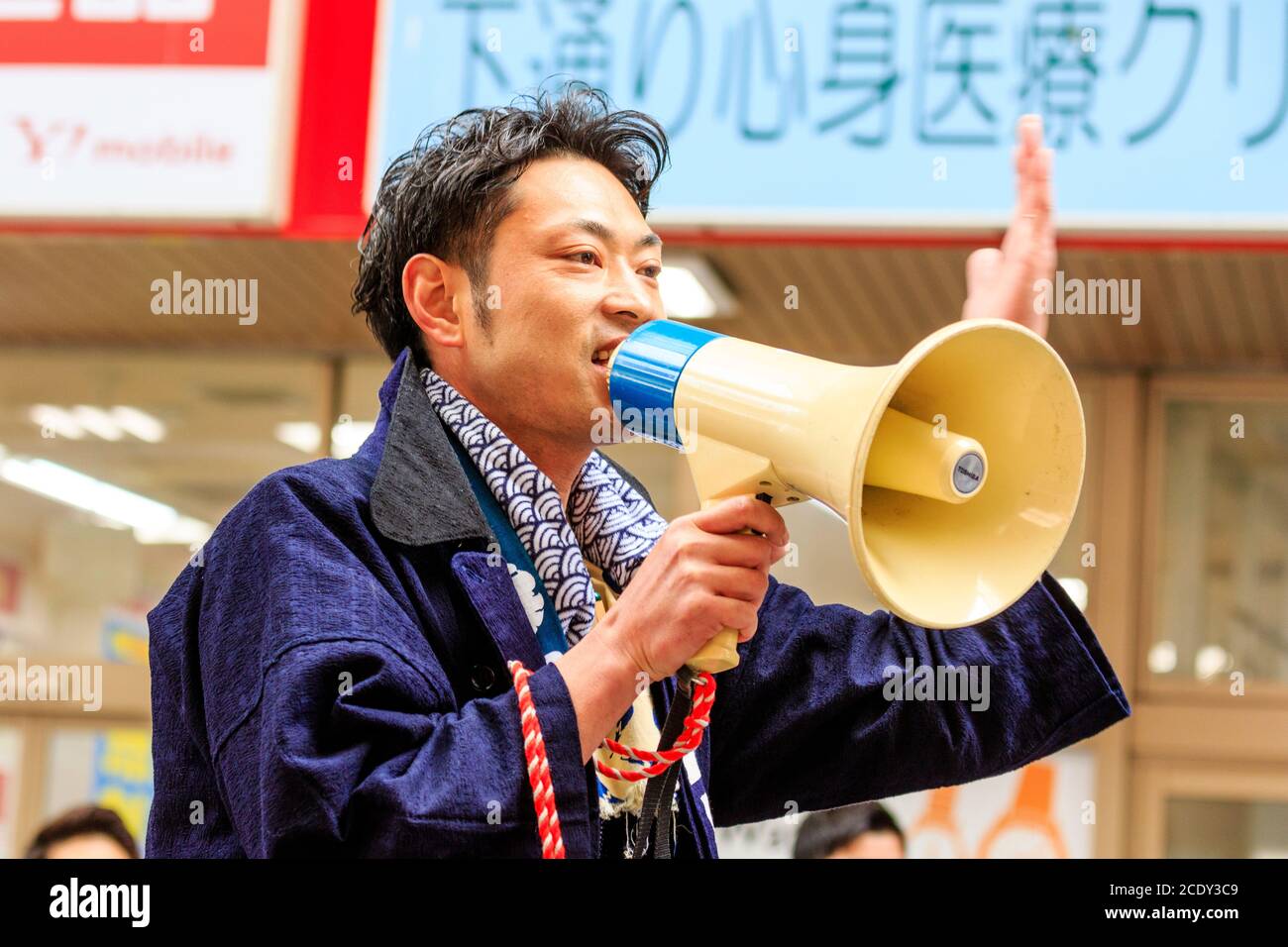 Side view, close up head and shoulders, of Japanese young man in yukata