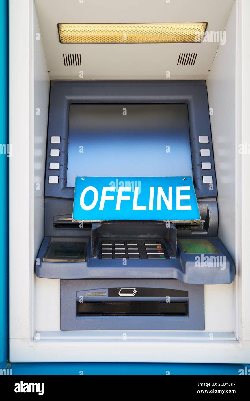 Automated bank card teller machine posted outside has a sign posted, because it is currently offline, no transactions are available, seen in Asia Stock Photo