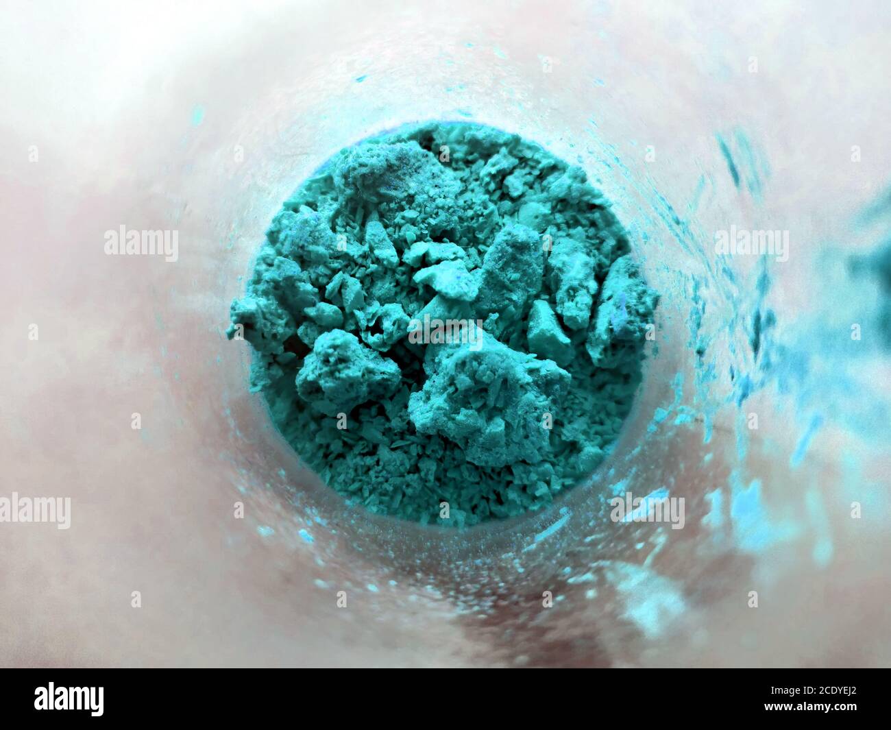 Azure powder in glass cup, bowl with ingredient close up. colored ...