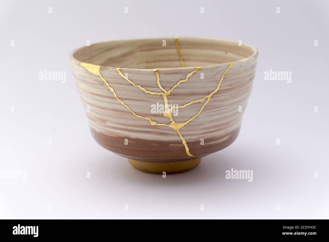 Antique Japanese ceramic kintsugi bowl restored with gold. Antique