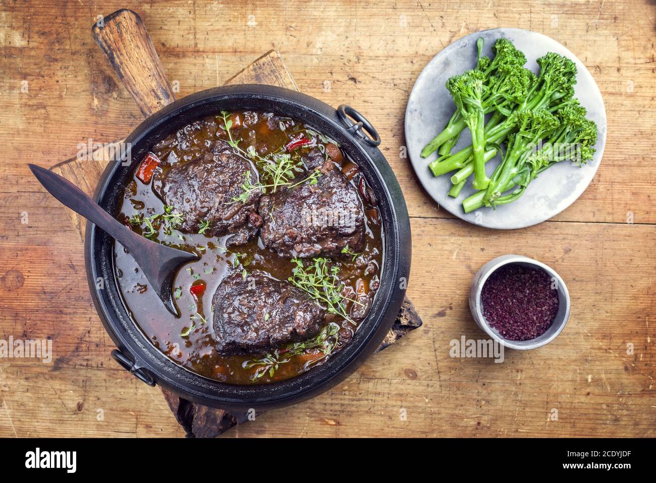 Traditional German braised beef cheeks in brown red wine sauce with