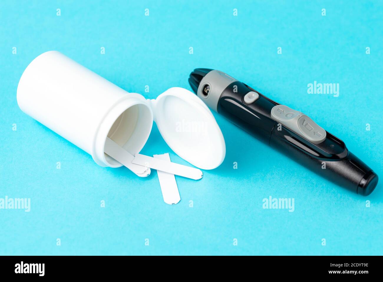 Diabetes kit, lancet with stripes on a blue background Stock Photo Alamy