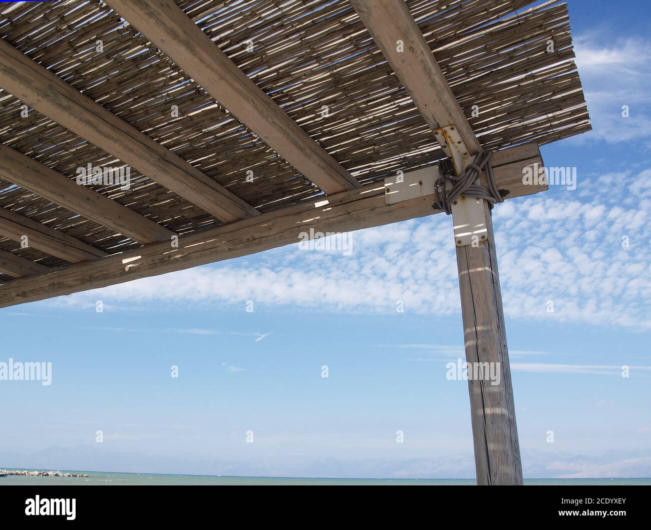 Covered shade area The Boathouse, Roda, Corfu, Greece Stock Photo - Alamy