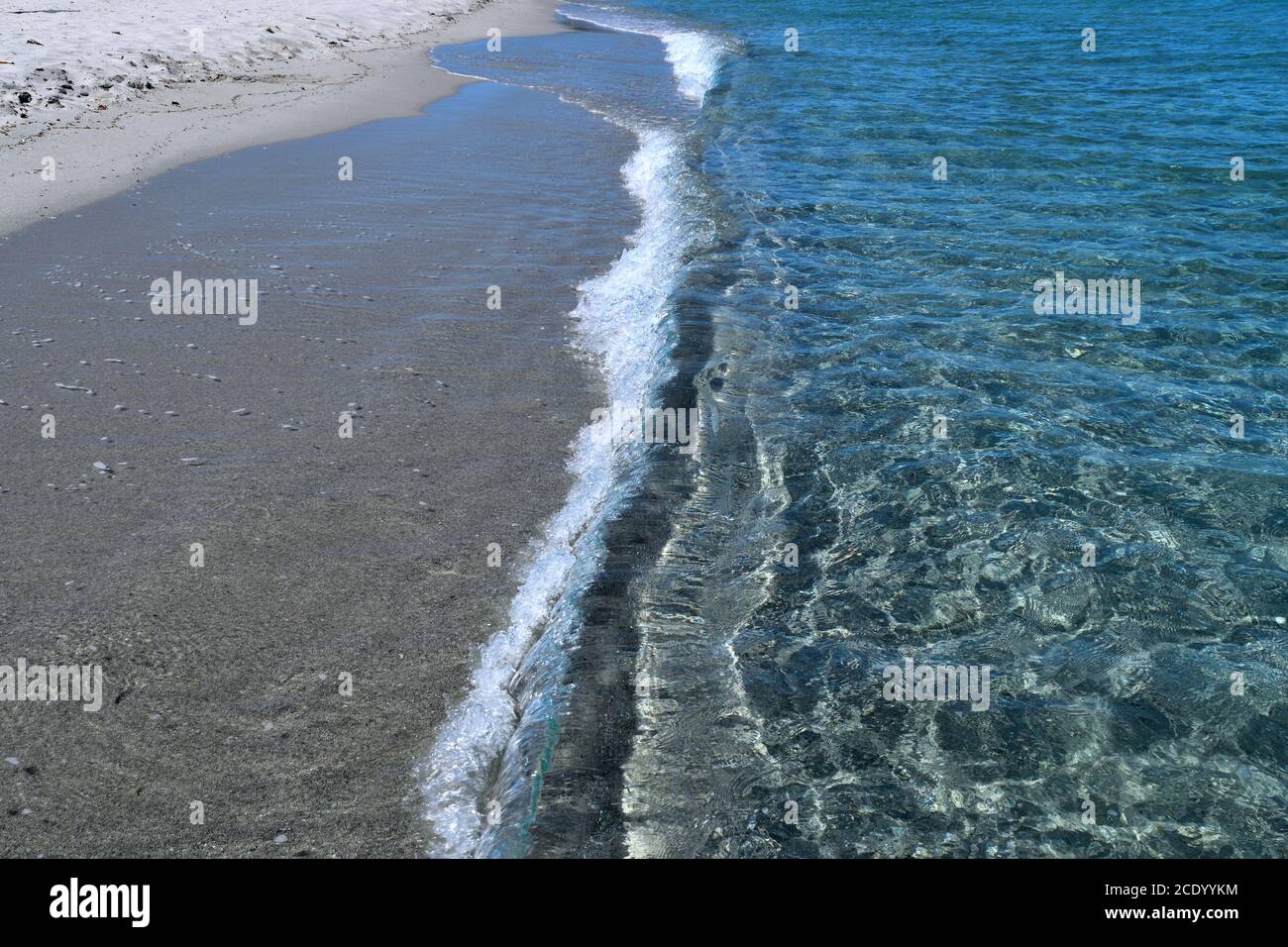 A closeup of the clear waters and white sand in Costa Smeralda, Sardinia, Italy Stock Photo
