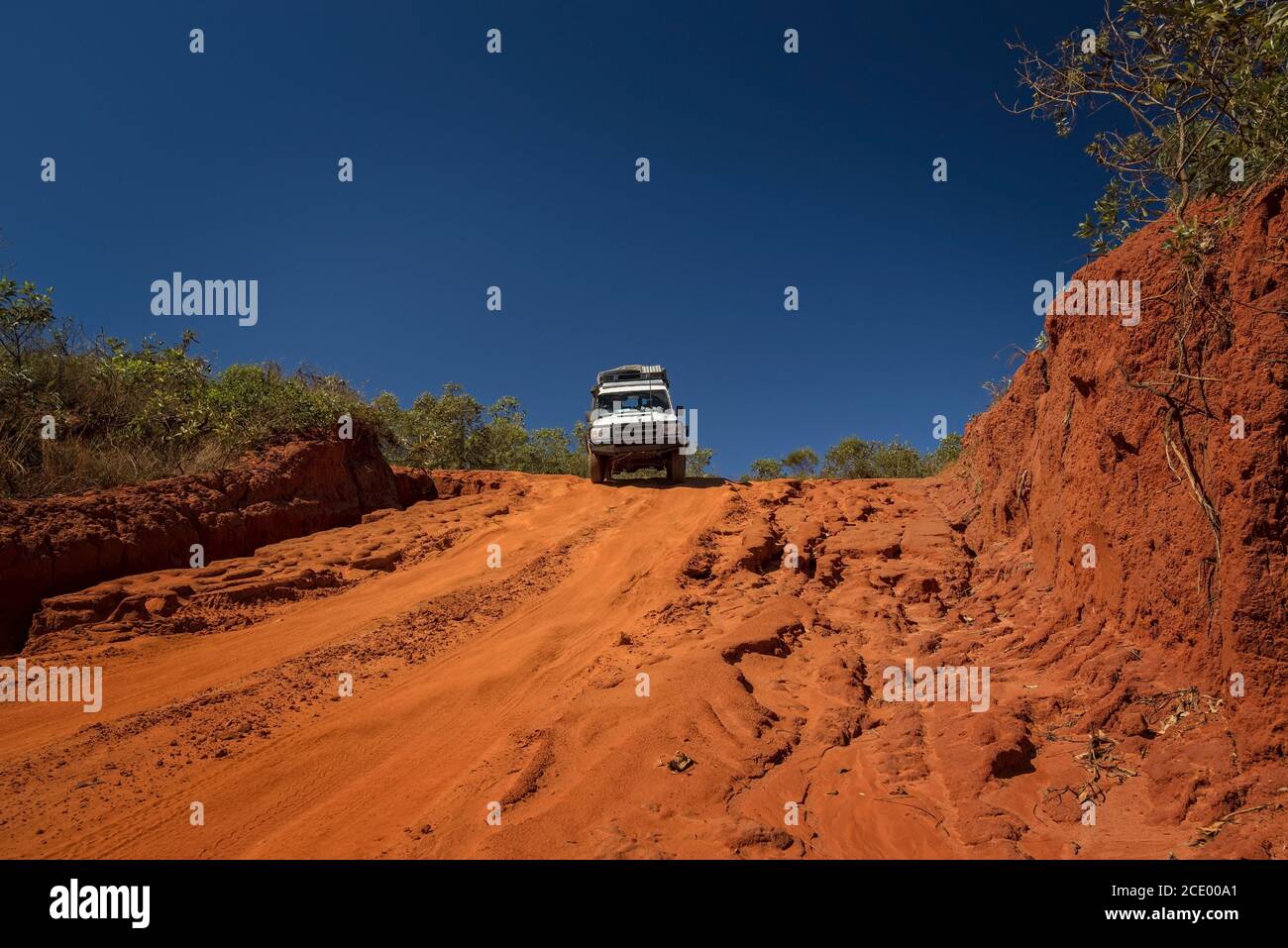 Western Australia Outback track with 4WD car downhill to the ocean at Dampier Peninsula Stock