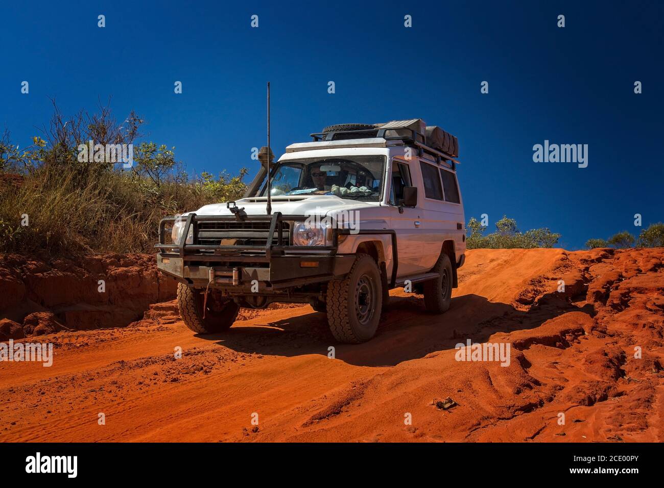 Western Australia Outback track with 4WD car downhill to the ocean at Dampier Peninsula Stock