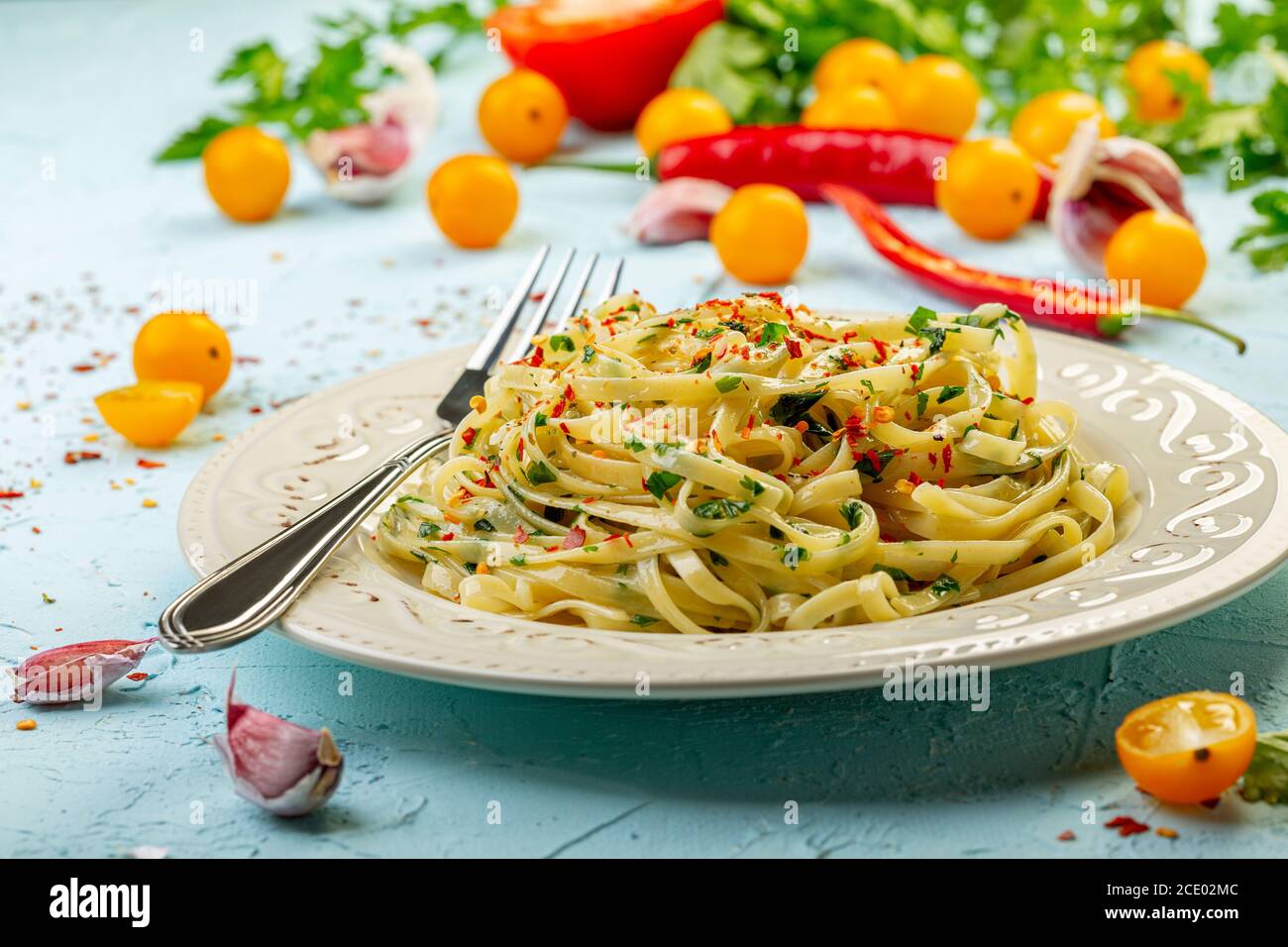 Linguini pasta with parsley and chili flakes Stock Photo Alamy