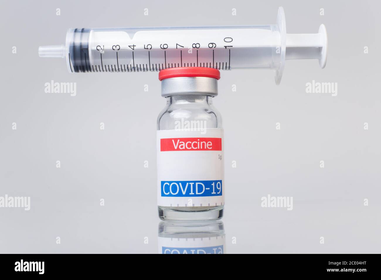 syringe and coronavirus vaccine vial isolated on white background Stock ...