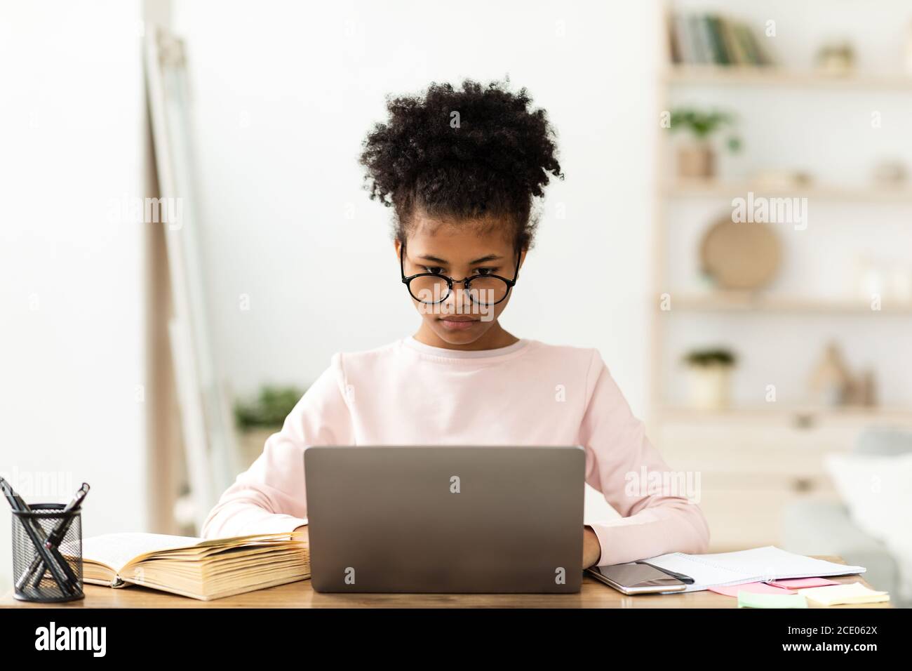 African American Girl At Laptop Learning Sitting At Home Stock Photo ...