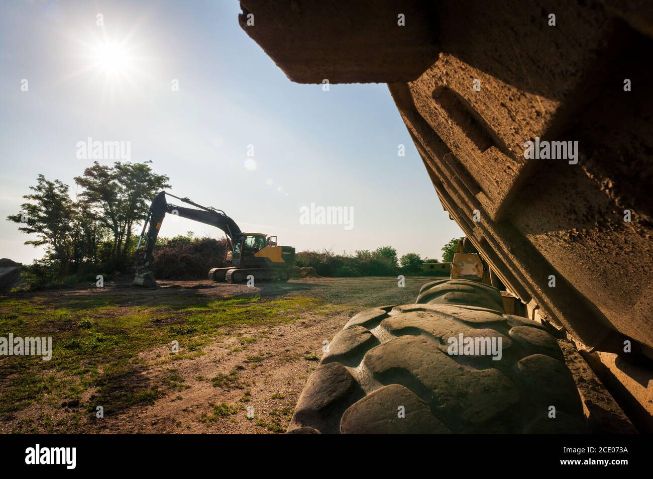 Excavator on construction site Stock Photo - Alamy