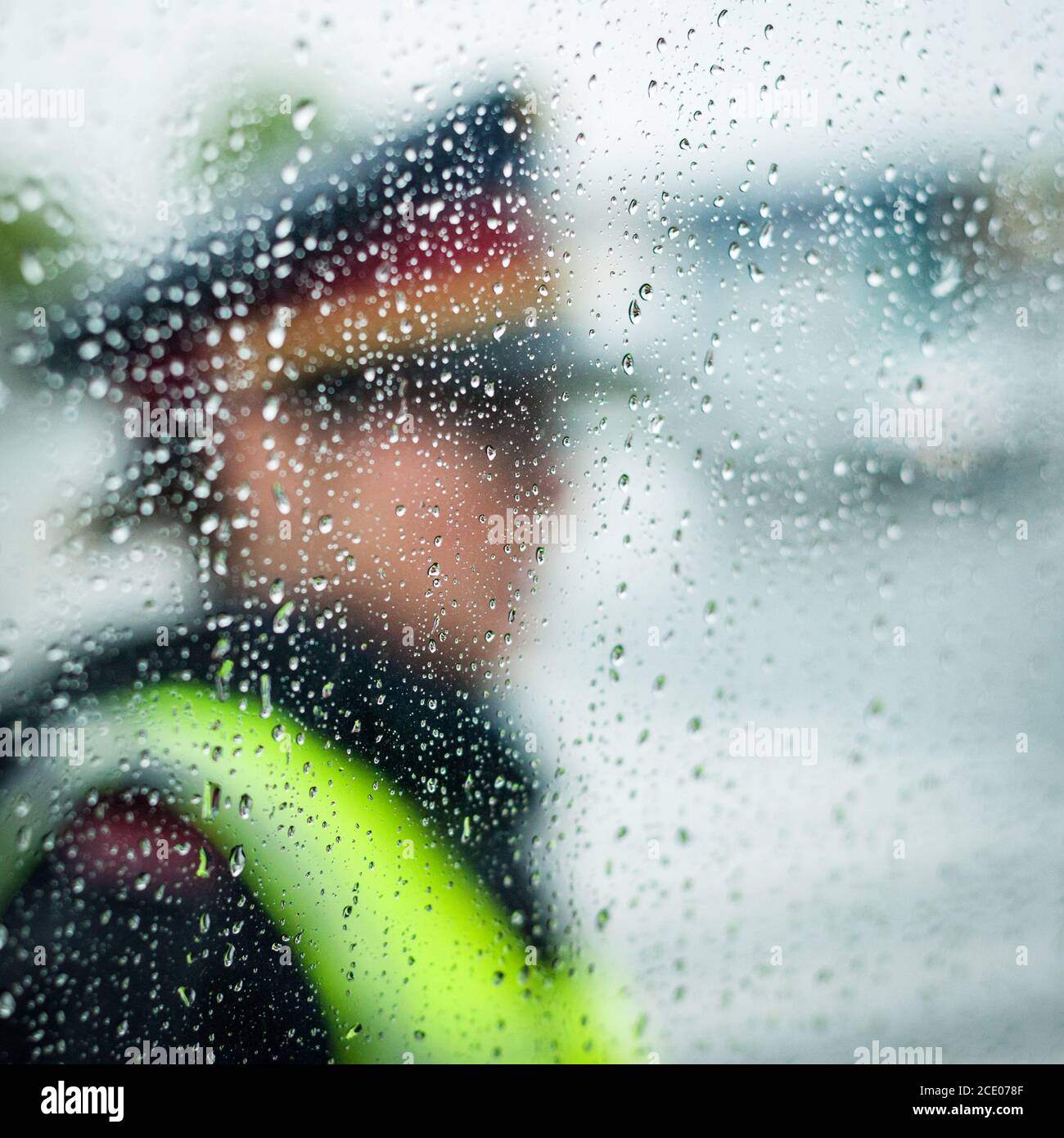 policewoman on traffic security in rainy weather Stock Photo