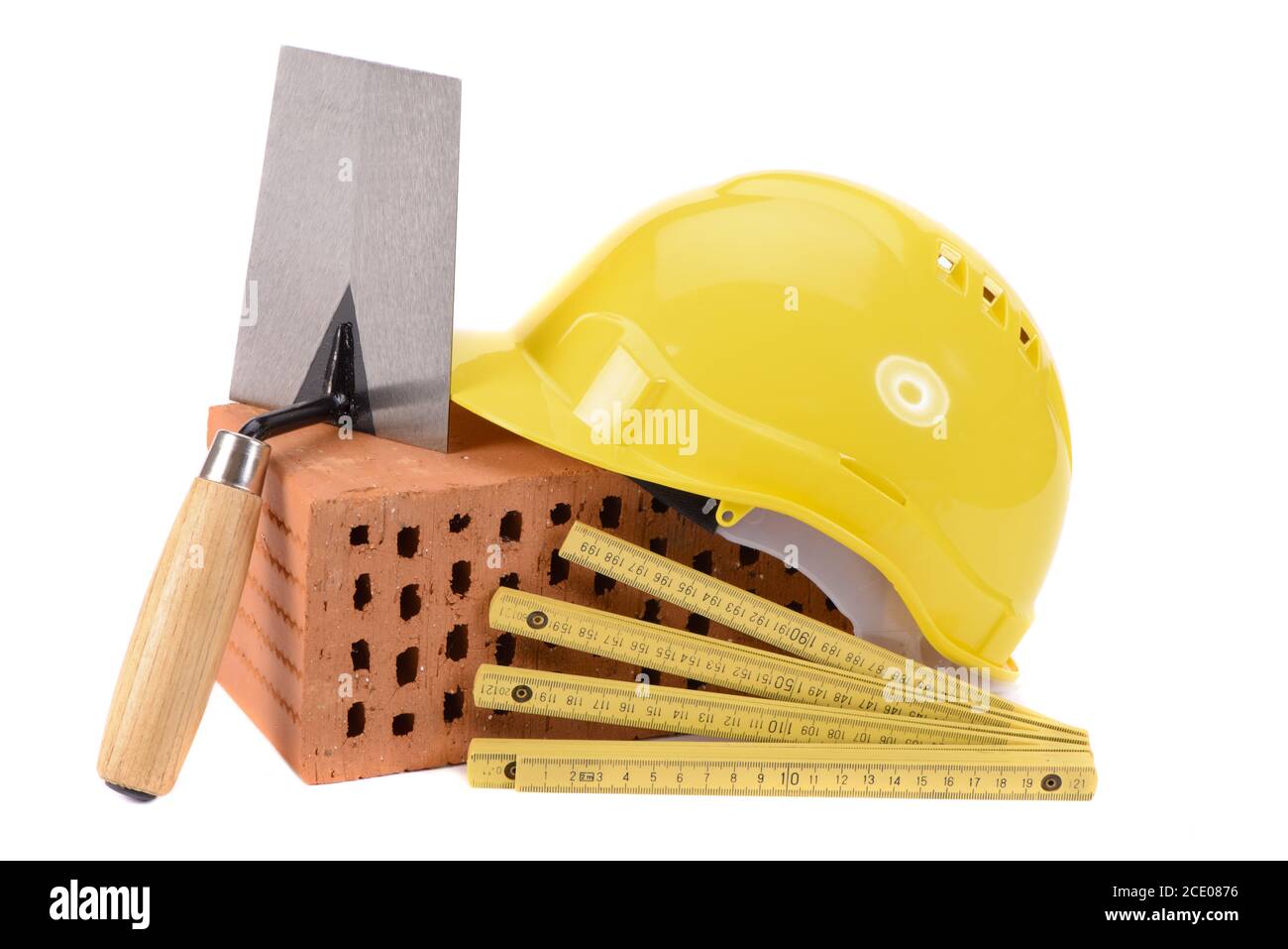 tools and brick as symbol for house construction Stock Photo