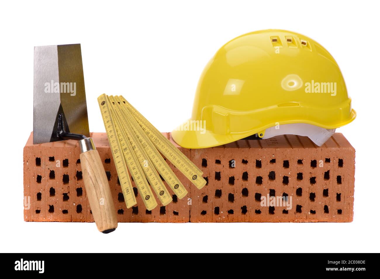 tools and brick as symbol for house construction Stock Photo