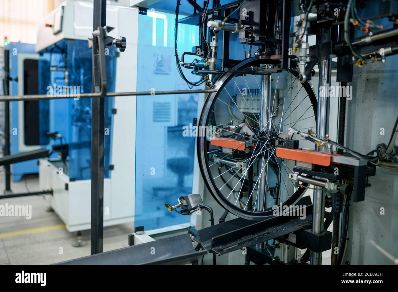 Bicycle wheels, assembly line, spokes installation Stock Photo Alamy