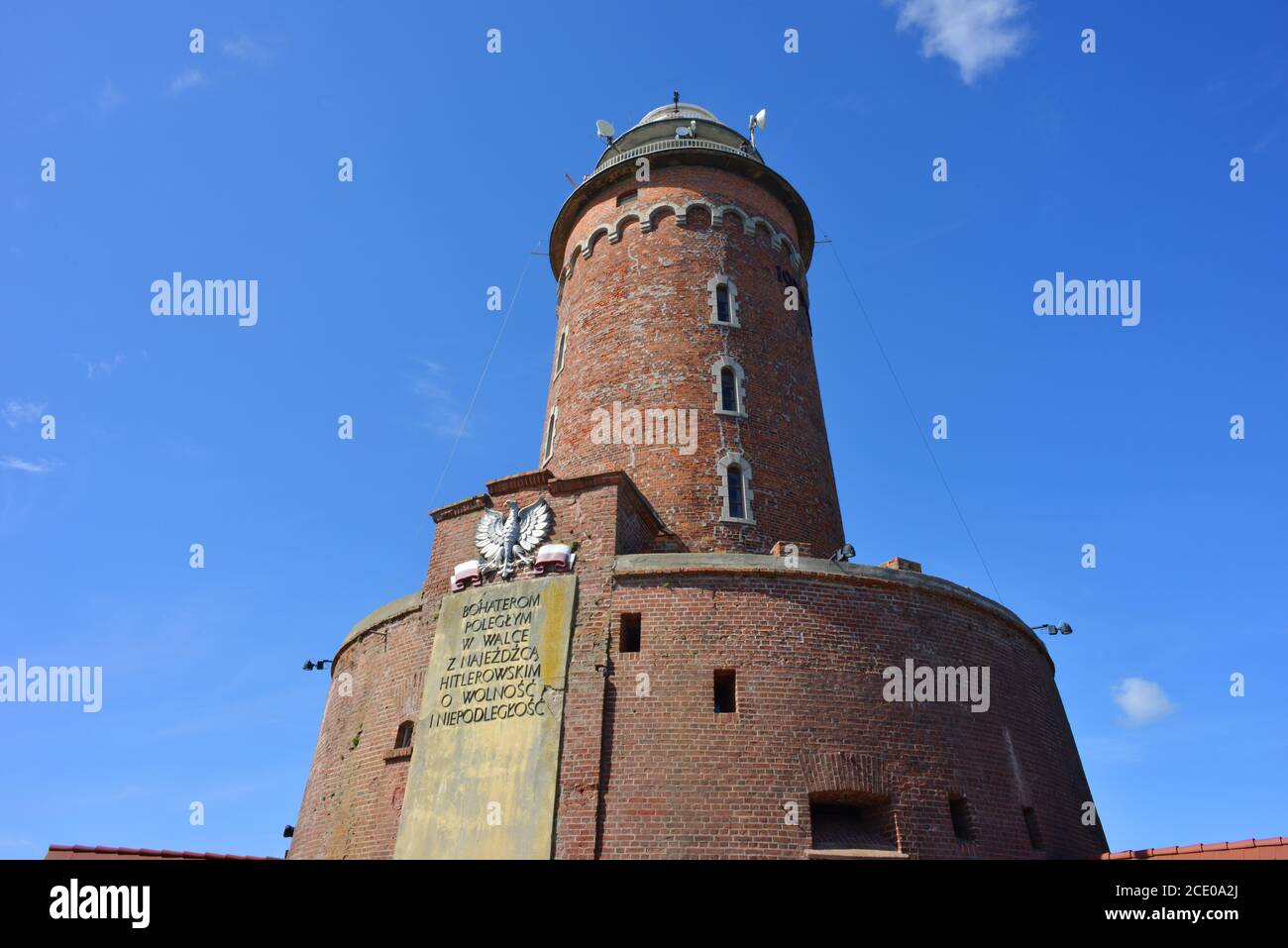 Kolobrzeg, Poland, light house landmark and fortress with plate of the Worldwar II history Stock Photo