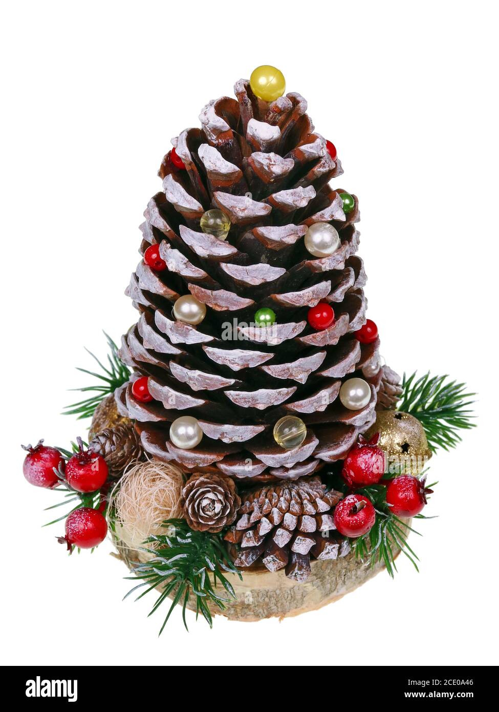 Christmas homemadefir tree in rustic style made large  cone of alpine european cedar tree , red berries  and pearls   isolated m Stock Photo